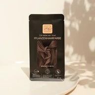 That's Me Organic Pflanzenhaarfarbe Warm Marocco Brown Verpackung auf weißem Teller