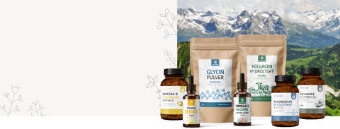 Sortiment an VITALOVE Nahrungsergänzungsmitteln vor Schweizer Bergpanorama