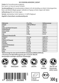 Rückseite einer Vitanur Bio Sonnenblumenkerne Gekeimt 300g Verpackung mit Nährwerttabelle, Zutaten, Qualitätssiegeln und Barcode.