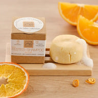 Festes Shampoo mit Bio-Arganöl und Orange, vegane Naturkosmetik, Seifenstück, Orangenscheiben